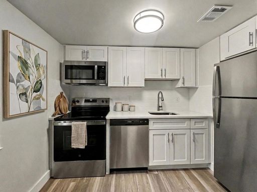 Renovated Modern & Charming Apartment with in-unit laundry and parking included