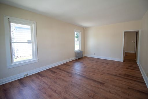 Downtown three-bedroom unit with heating fuel, trash removal, water & sewer included; washer & dryer hookups available!