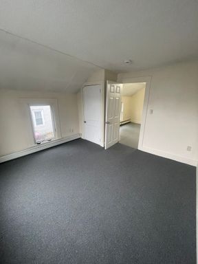 Downtown two-bedroom apartment with heat, trash, water/sewer included, brand new carpets