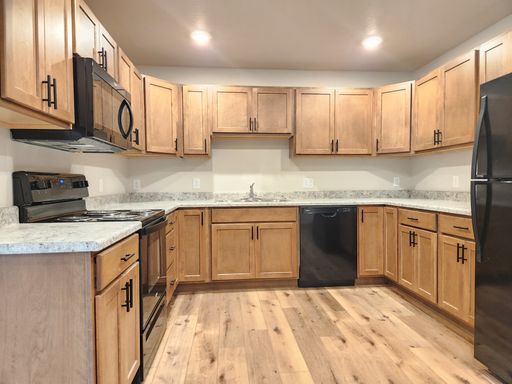 2-Bed, 1-Bath with Private Deck and Attached Garage with Most Utilities Included in Rent – photo 1