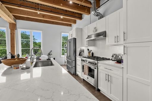 Spacious 2-Bedroom 2-Bath Luxury Apartment with In-Unit Washer/Dryer, Exposed Brick & High Ceilings – Pet-Friendly with Parking Near Lake Forest Amenities