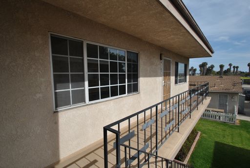 Los Alamitos 2-Bedroom Upper-Level Apartment | Garage + Additional Parking | Water, Trash & Gas Included – photo 1