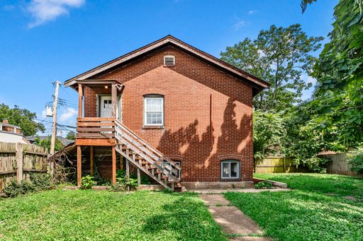 Your new home is waiting at 3948 S Grand Blvd - Rear! – photo 1