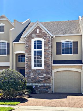 Move in September! Stunning 4 bedroom + Loft, 2.5 bath Townhome Gated community in Avalon Park. 1 car attached garage. HOA handles lawn care. Primary bedroom on 1st floor. – photo 1