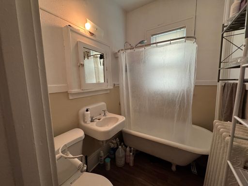 This studio apartment has amazing character—that arched opening