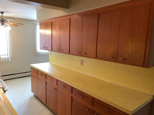 Top floor unit. These large 1 bedrooms have a galley style kitchen – photo 1