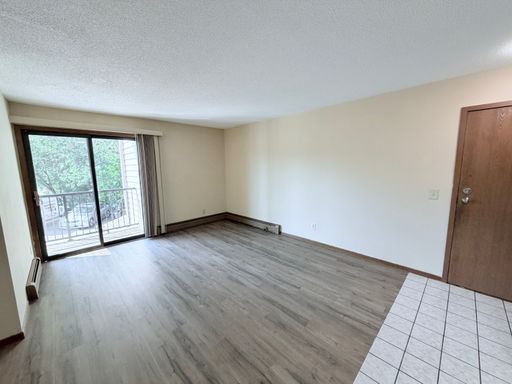 Spacious 2BR in Mounds View with Open Floor Plan, Walkout Patio & Garage Options!