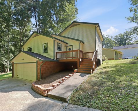 Wooded Retreat with Acreage, Two-Car Garage & Google Fiber – photo 1
