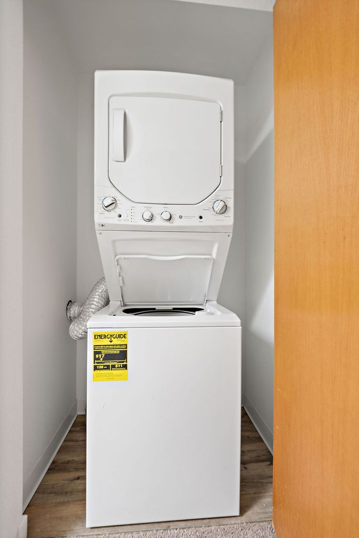 Laundry room at Bellevue One Condo Apartments