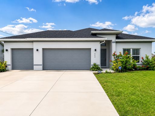 Modern Cape Coral Home with 3-Car Garage, Designer Upgrades & Flexible 4-Bedroom Layout! – photo 1