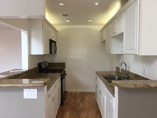 Beautifully Renovated 2 Bed/2 Bath Apartment in Canoga Park with Hardwood Floors, Central Air Conditioning, Stainless Steel Appliances, Private Balcony, and Laundry HookUps – photo 1