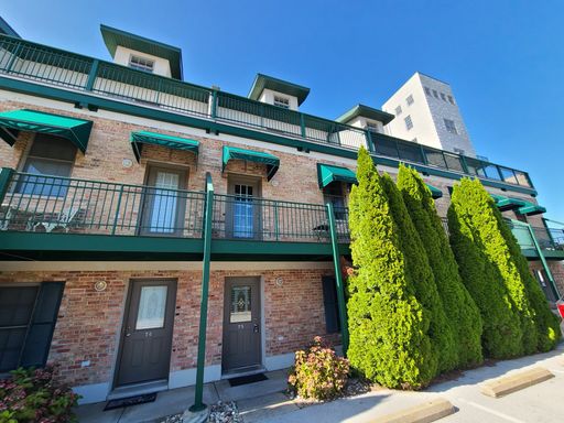 Fully Furnished Executive Garden Level Condo Downtown St. Joseph!