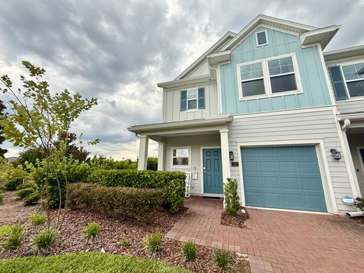 BEAUTIFUL END-UNIT TOWNHOME WITH SCREENED PATIO AND LAKE VIEWS