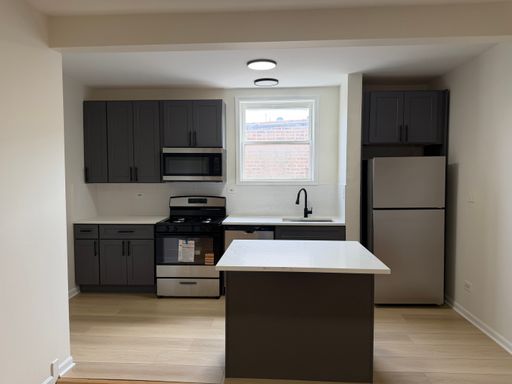 Beautifully Updated 3 Bedroom with Quartz Counters, Island & Hardwood Floors – photo 1