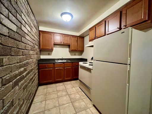 Cozy One Bedroom Apartment! Exposed Brick, Off-Street Parking & More! Call Today!