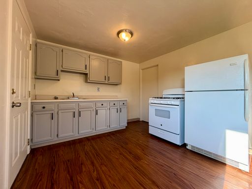 Charming Two Bedroom Townhome with a Private Basement & a Shared Backyard Space! Call Today!
