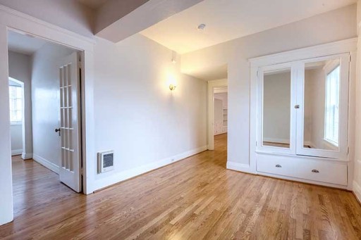 Light-Filled Corner Flat in Timeless Historic Landmark with Bonus Workspace! – photo 1
