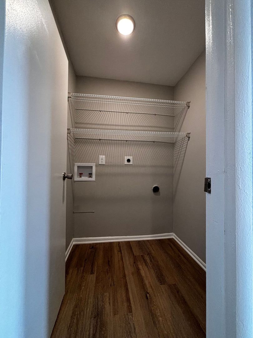 Laundry closet with washer and dryer hookups