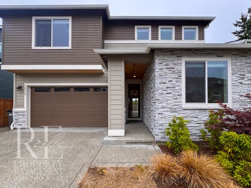 Naturally Lit 5-Bedroom Home with Fireplace, Main-Level Bedroom & Fenced Backyard – photo 1