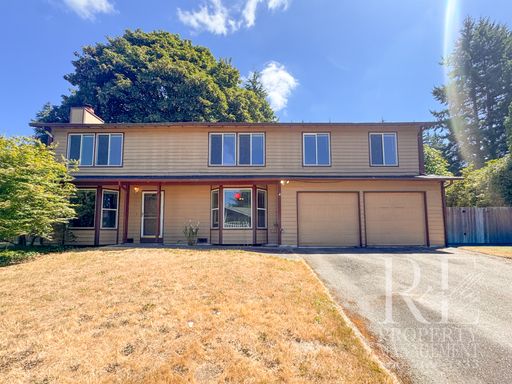 Cozy 4-Bedroom Home with Two Fireplaces, Fenced Backyard & 2-Car Garage – photo 1