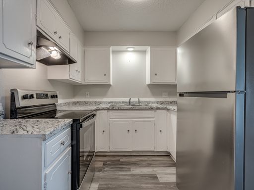 Bright and airy space featuring vaulted ceilings and a private balcony. – photo 1
