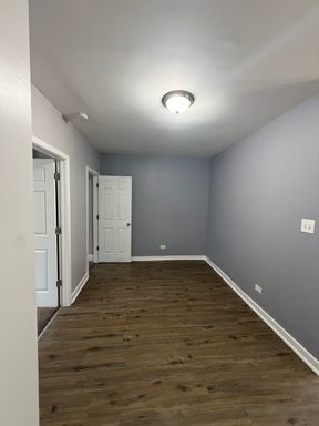 Discover 7000 S Stewart, a two-bedroom, one-bath apartment in Chicago offering practical living with hot water included – photo 1
