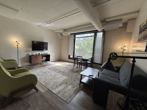 Unfurnished Two Bedroom Suite with Plank Floors and a Light & Bright Living Space – photo 1