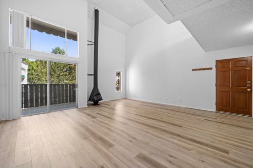 Top-Floor 1-Bedroom Condo with Vaulted Ceilings and Private Balcony