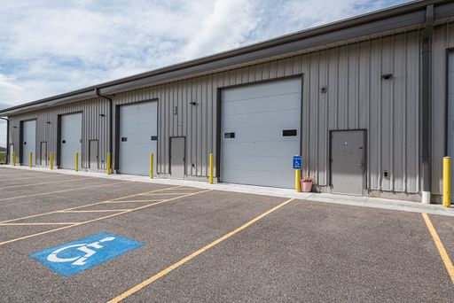 Versatile Industrial Unit with High Clearance and Dual Offices in Ammon