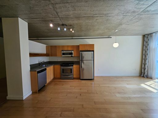 City Center Studio Condo | Secure Underground Parking | Steps From Dining Options | Near Providence Park | Hardwood Floors | Natural Light – photo 1
