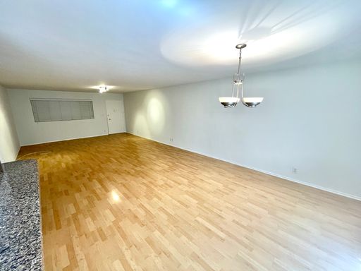 A beautiful lower unit with lots of storage, one covered parking and combo washer/dryer – photo 1