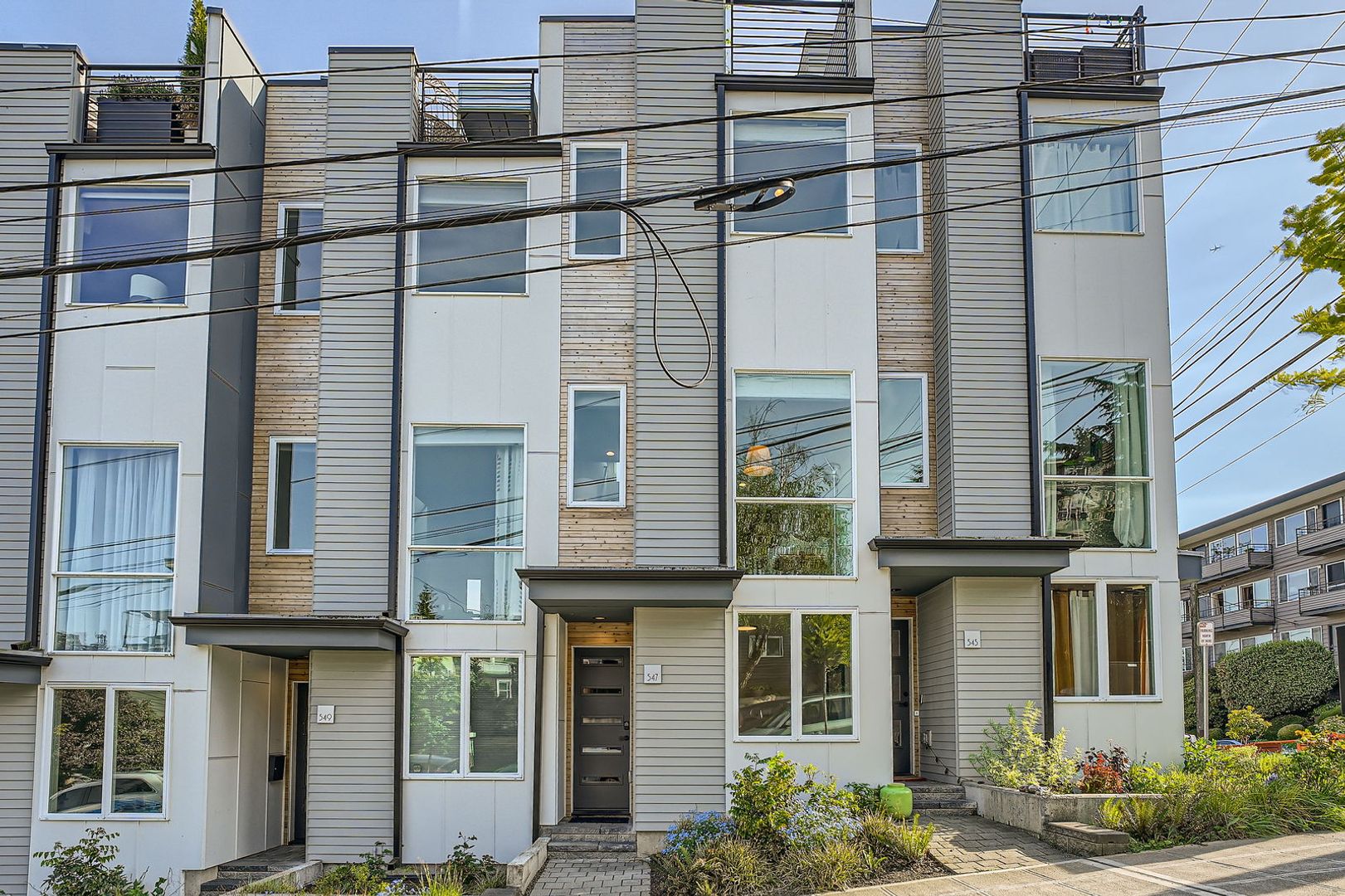Modern stylings and cutting-edge conveniences meet in this spectacular Queen Anne hillside location!