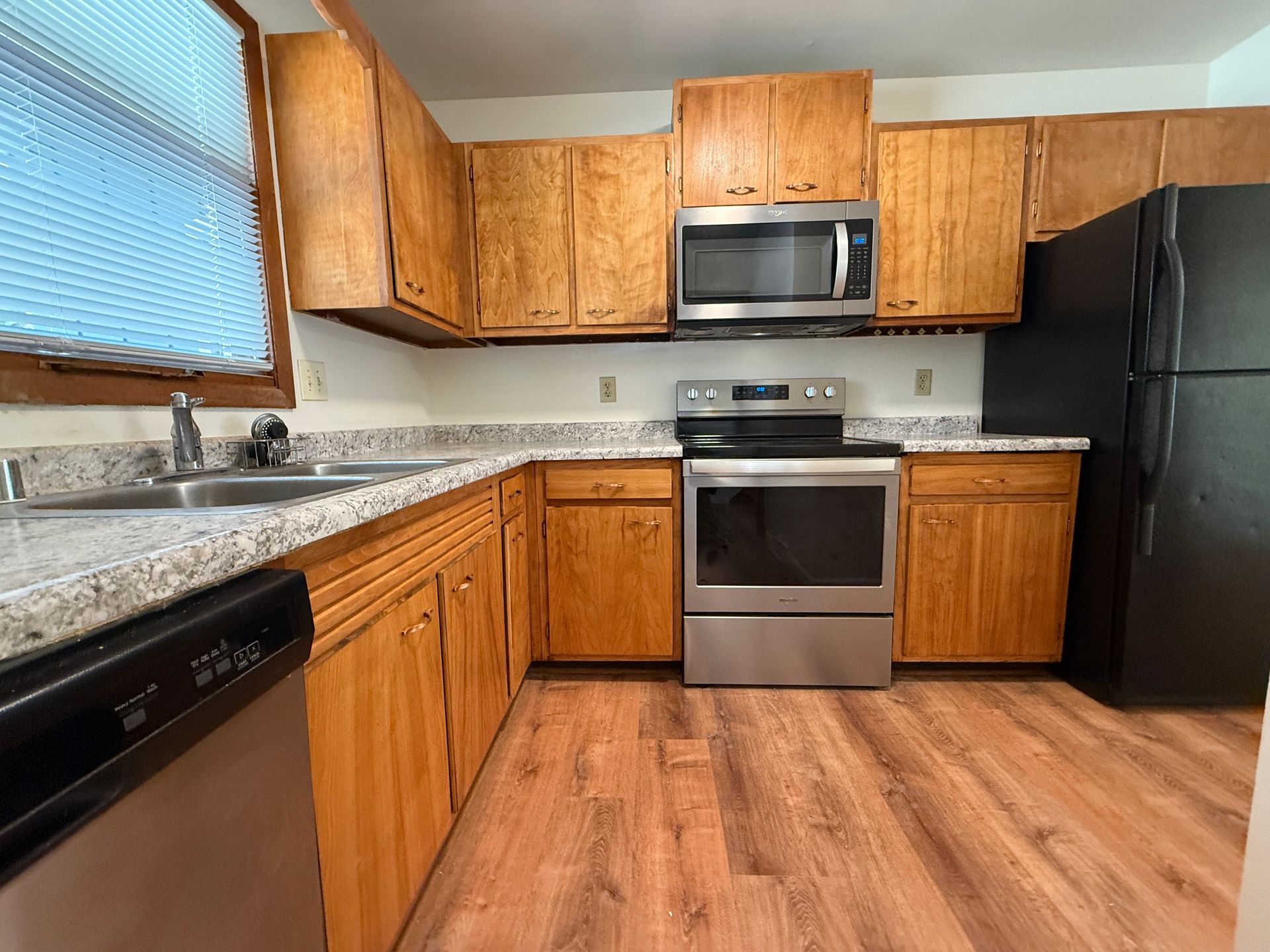 Call for rent special! New deck! 3 Bedroom, updated kitchen, updated flooring, garage, driveway, and fenced yard - 9 month lease available! 3 of 12