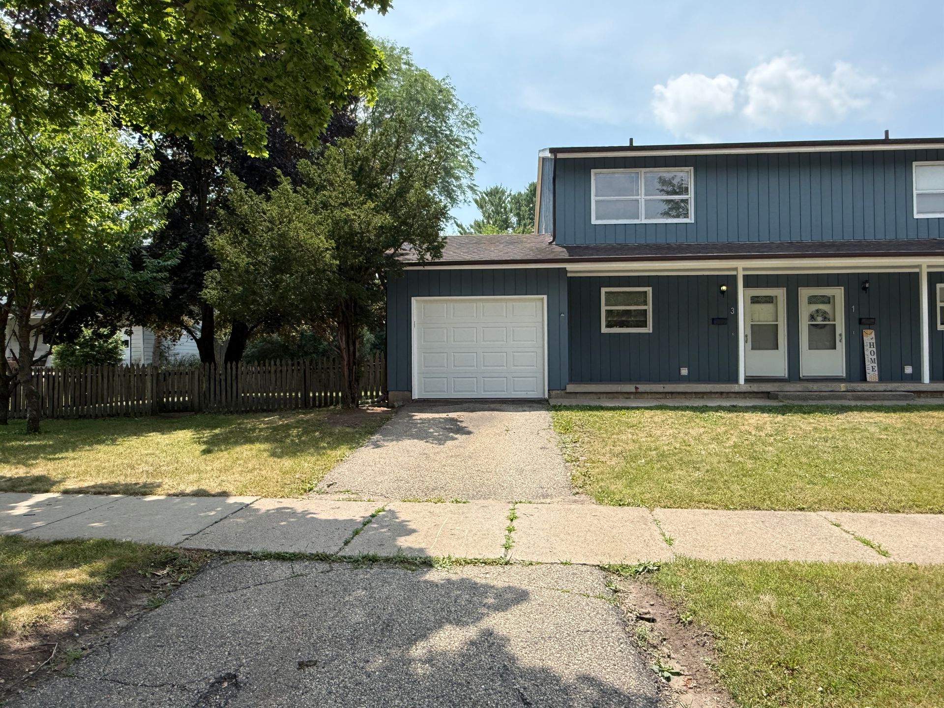 Call for rent special! New deck! 3 Bedroom, updated kitchen, updated flooring, garage, driveway, and fenced yard - 9 month lease available! 5 of 12
