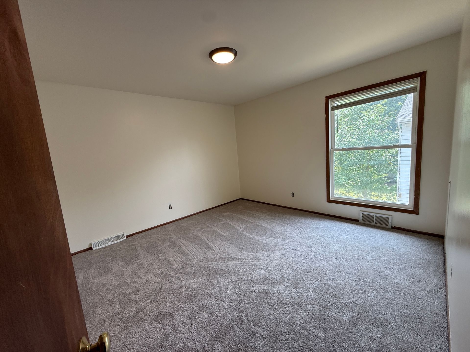 Call for rent special! New deck! 3 Bedroom, updated kitchen, updated flooring, garage, driveway, and fenced yard - 9 month lease available! 9 of 12
