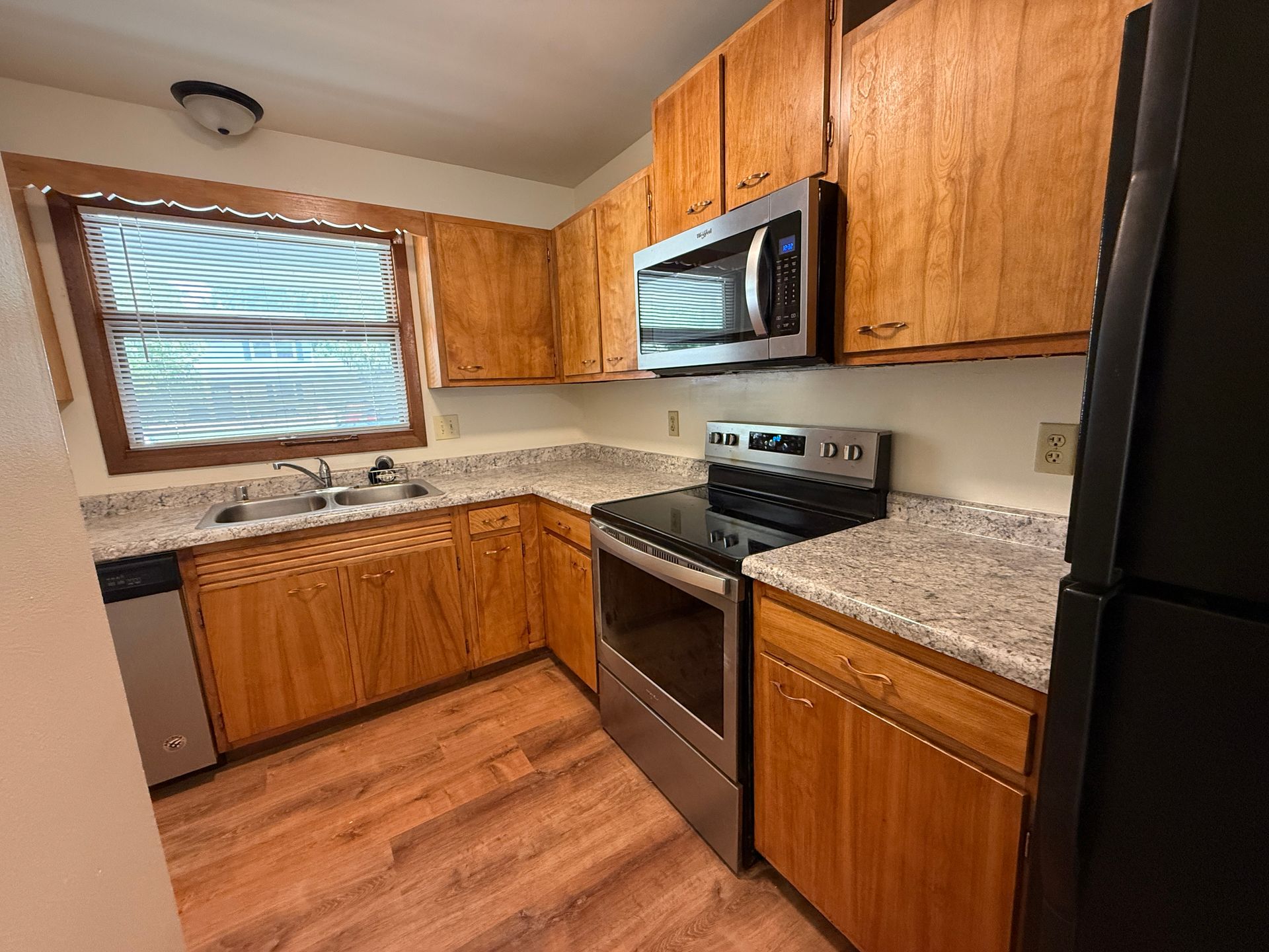 Call for rent special! New deck! 3 Bedroom, updated kitchen, updated flooring, garage, driveway, and fenced yard - 9 month lease available! 7 of 12