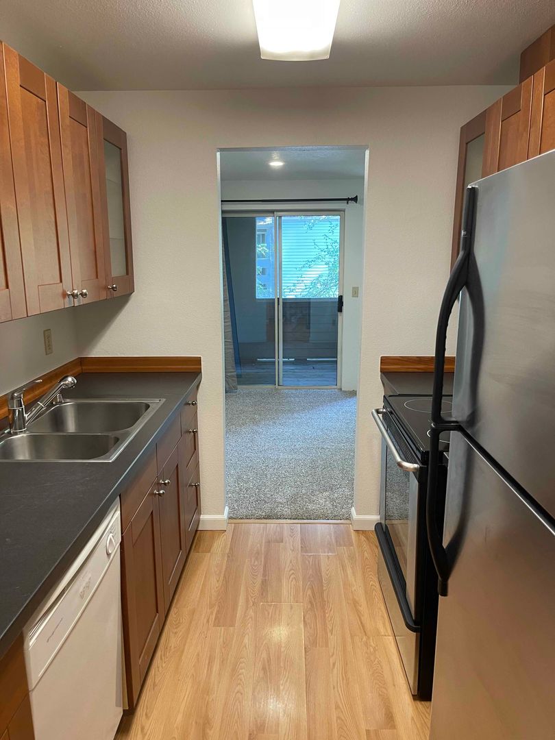Bright and Airy One Bedroom Condo - Water, Sewer & Trash Covered! - $300 off first month's rent!