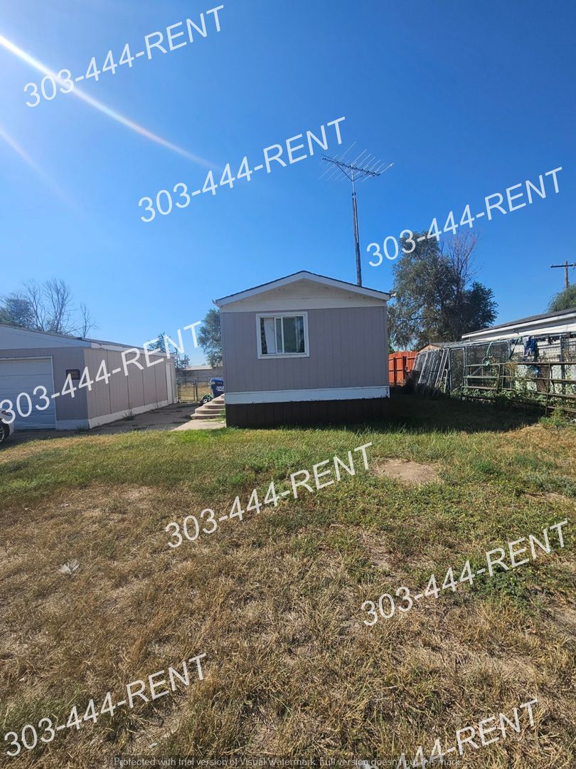 Log Lane Village House: 203 Oak Street