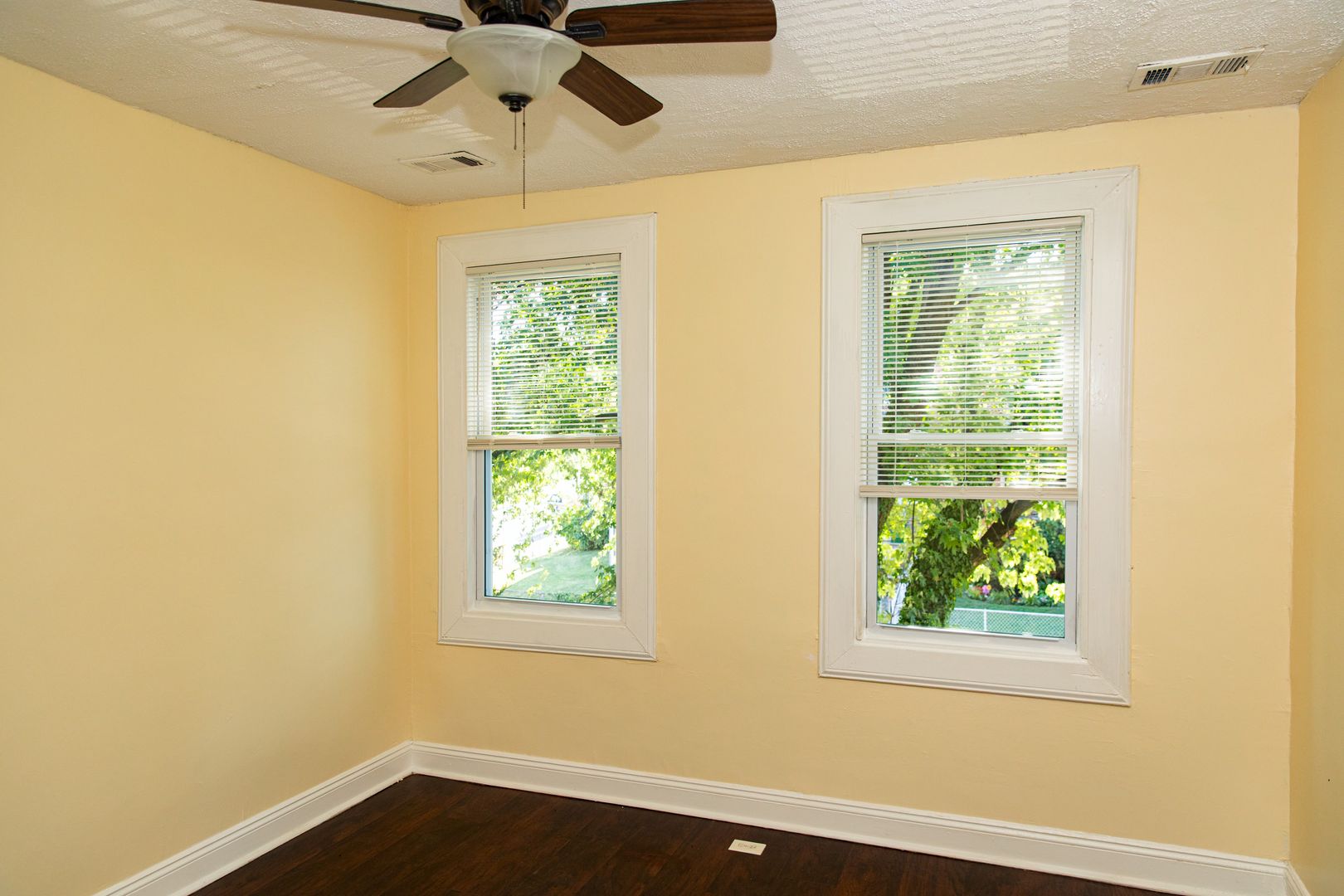 Bright bedroom with ceiling fan