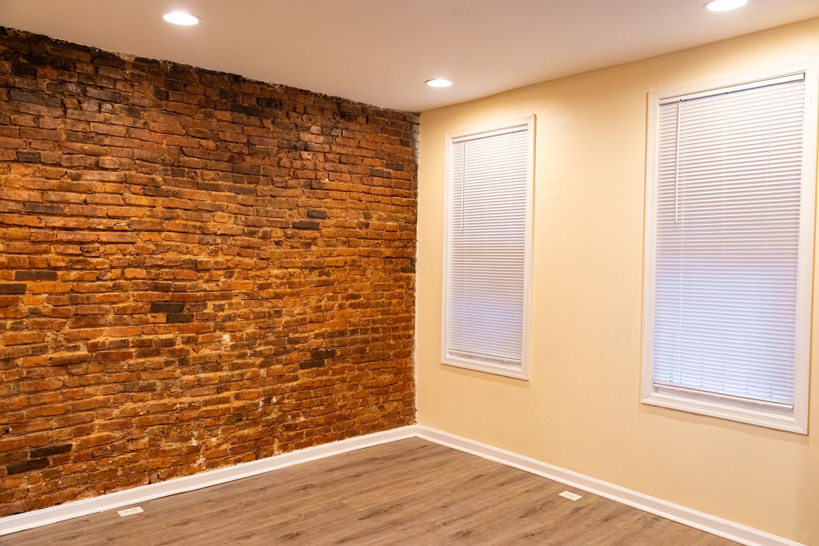 Living room with exposed brick wall