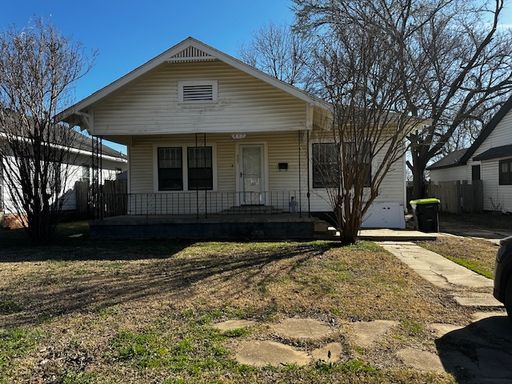 Fresh 3 bedroom 1.5 bath home with large lot and covered porch