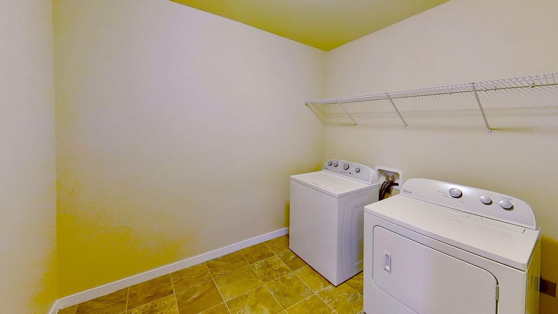 Laundry room at Charming 4-Bedroom 2.5-bath Duplex. Schedule a tour today!