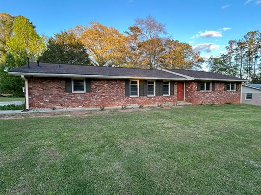 JUST LIKE NEW! Landlord just finishing up doing a total remodel on this 3 bedroom/2 bath home with large outbuilding. – photo 1