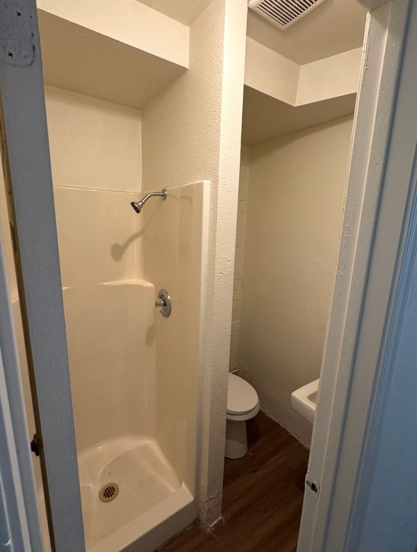 Apartment bathroom — representative home at Earll Drive Apartments.