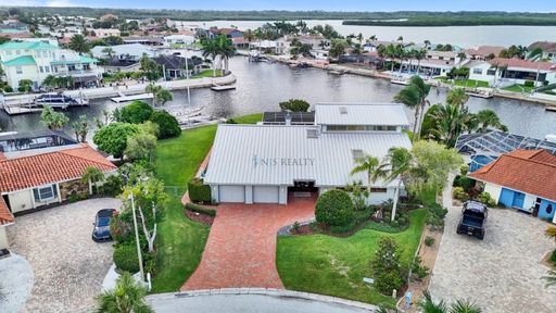 Experience exceptional waterfront living in this stunning 5-bed, 3-full-bath, 2-half-bath home boasting nearly 5,000sf of luxurious living space. – photo 1