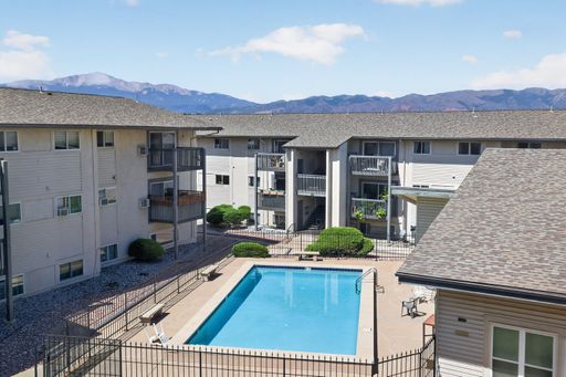Welcome Home to Your Remodeled 2BD Top-Floor Condo w/ Pikes Peak Views – Utilities Included – photo 1
