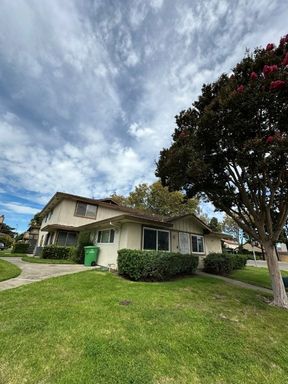 Nor Cal Realty, Inc.- 2 Bedroom/1 Bath Condo with Covered Car Port.