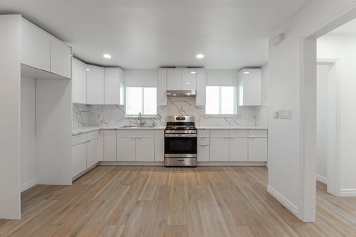 BASICALLY A 2BR APT! COMPLETELY REMODELED, BRIGHT & AIRY 750 SQ FT, TOP-FLOOR REAR APARTMENT W/ ALL-NEW DESIGNER AMENITIES CLOSE TO SCHOOLS, PARKS, SHOPPING & EASY FREEWAY ACCESS! – photo 1