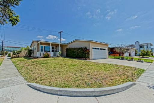 PARTIALLY REMODELED, CHARMING & BRIGHT HOME ON A LARGE CORNER LOT W/ FRONT PORCH, LARGE FRONT LAWN & REAR PATIOS CLOSE TO MALL, SHOPPING & MINS TO BEACH! – photo 1