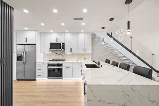 FINISTERRA ON THE LAKE: Remodeled 3 Bedroom with Loft 2 Bath 2 Two Story Condo With Step Down Living Room – photo 1